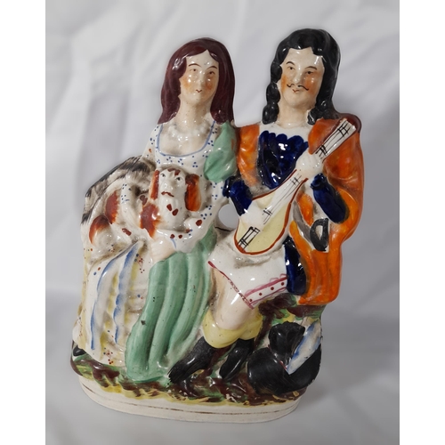 232 - A MIXED GROUP OF 19TH CENTURY POTTERY AND PORCELAIN MODELS, including a Staffordshire spaniel, four ... 