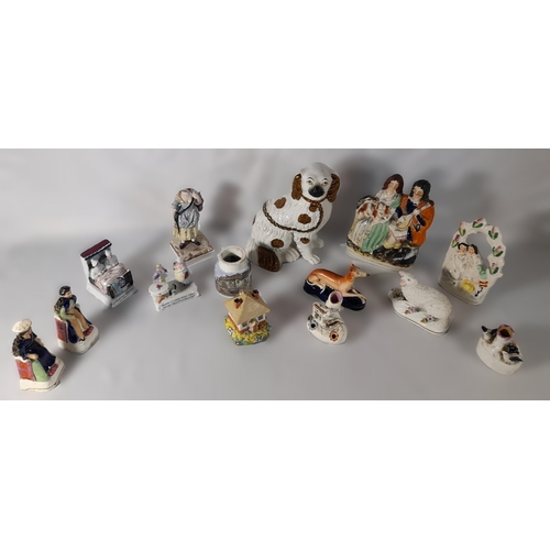 232 - A MIXED GROUP OF 19TH CENTURY POTTERY AND PORCELAIN MODELS, including a Staffordshire spaniel, four ... 