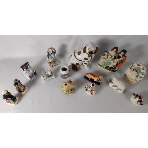 232 - A MIXED GROUP OF 19TH CENTURY POTTERY AND PORCELAIN MODELS, including a Staffordshire spaniel, four ... 