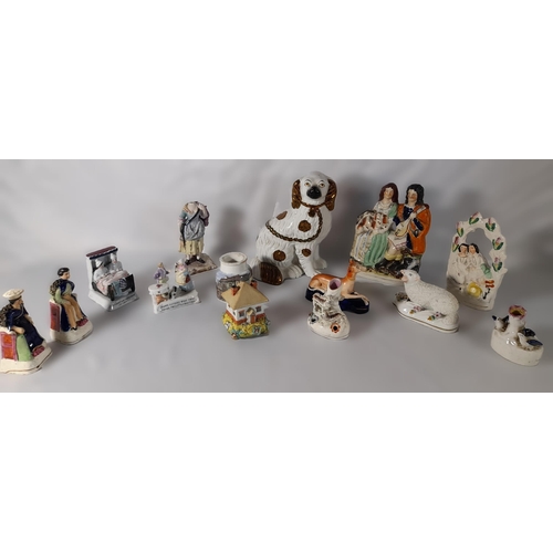 232 - A MIXED GROUP OF 19TH CENTURY POTTERY AND PORCELAIN MODELS, including a Staffordshire spaniel, four ... 