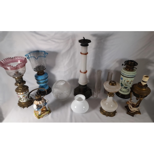 237 - A GROUP OF SIX 19TH CENTURY OIL LAMP BASES, including a Chinese porcelain lamp base, four coloured g... 