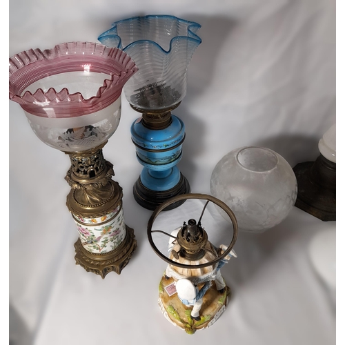 237 - A GROUP OF SIX 19TH CENTURY OIL LAMP BASES, including a Chinese porcelain lamp base, four coloured g... 