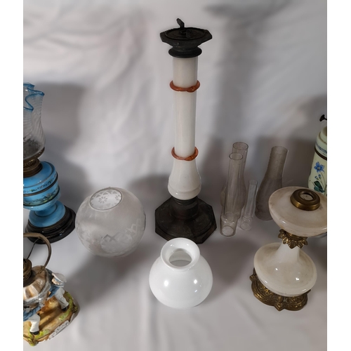 237 - A GROUP OF SIX 19TH CENTURY OIL LAMP BASES, including a Chinese porcelain lamp base, four coloured g... 