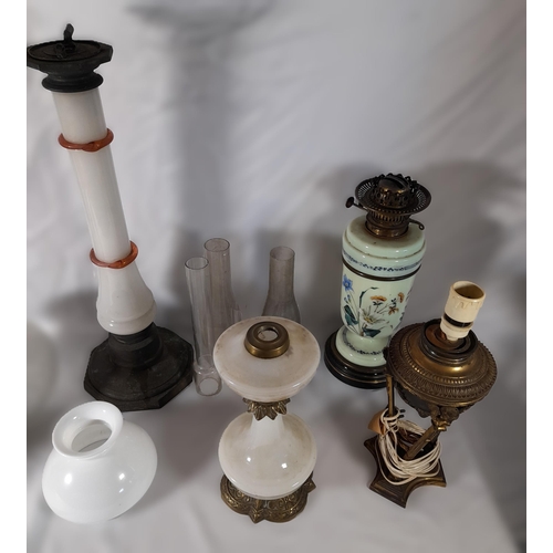 237 - A GROUP OF SIX 19TH CENTURY OIL LAMP BASES, including a Chinese porcelain lamp base, four coloured g... 