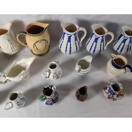 242 - A GRADUATED SET OF VICTORIAN PARIAN WARE JUGS AND A MIXED GROUP OF JUGS AND PITCHERS, including a Du... 