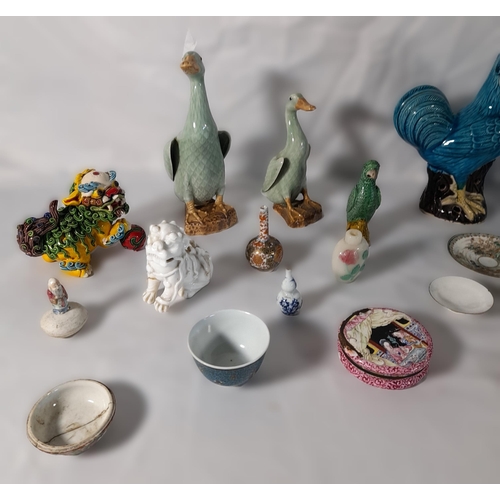 243 - A COLLECTION OF CHINESE AND JAPANESE FIGURES AND TRINKET MODELS, the lot includes a Sancai parrot, t... 