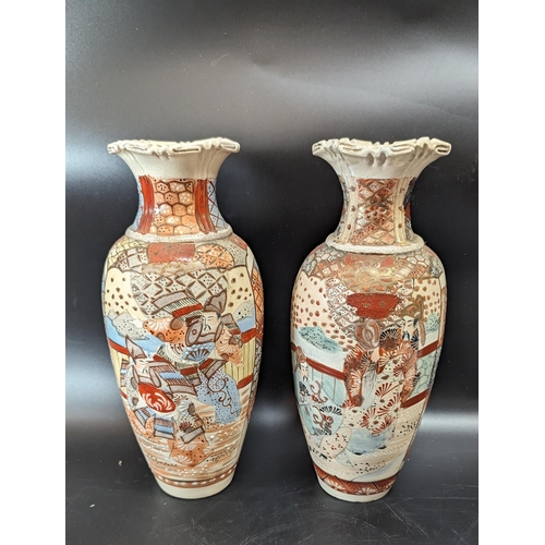 497 - A Pair of Japanese Satsuma Vases (repair to rim of one).