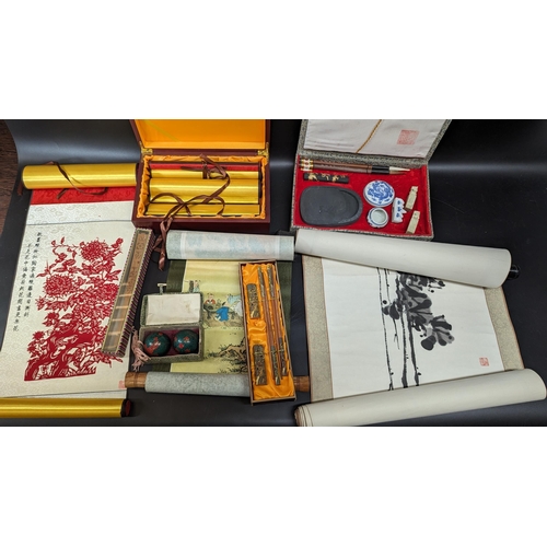 498 - An Assortment of Chinese Scrolls, Brushes, Chopsticks, Fan, Baoding Balls etc.