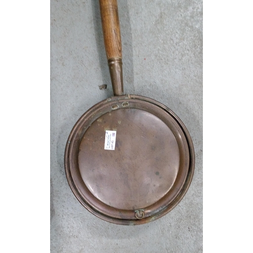 61 - A Pair of Copper Bed Pans.