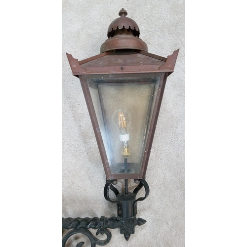 654 - A Copper and Wrought Iron Vintage Style Wall Hanging Outside Lamp. 90cm H x 48cm w.