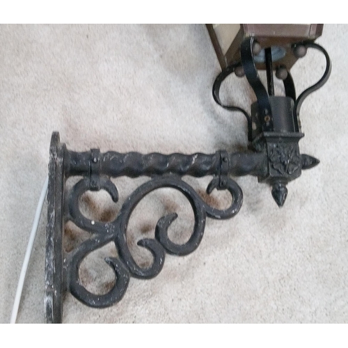 654 - A Copper and Wrought Iron Vintage Style Wall Hanging Outside Lamp. 90cm H x 48cm w.