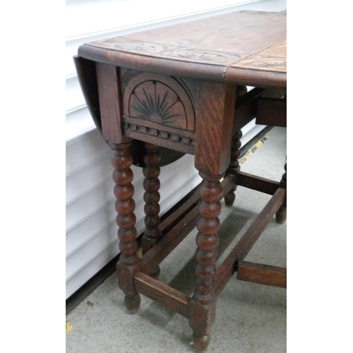 724 - A Carved Gate Leg Table 72cm H x 76cm W, 106cm Open, 35 cm Closed.