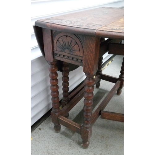 724 - A Carved Gate Leg Table 72cm H x 76cm W, 106cm Open, 35 cm Closed.