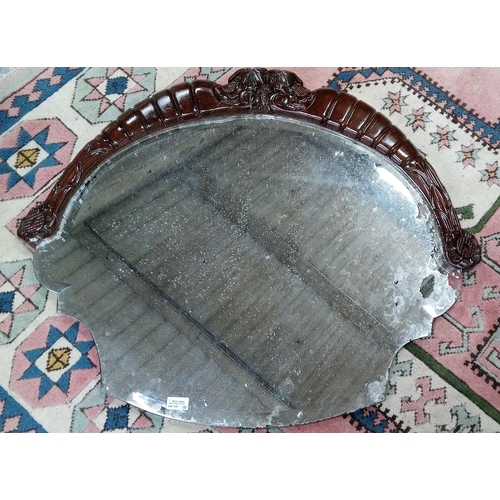 764 - An Antique Oval Over Mantle Mirror. Mirror in distressed state and frame in need of attention. 78cm ... 