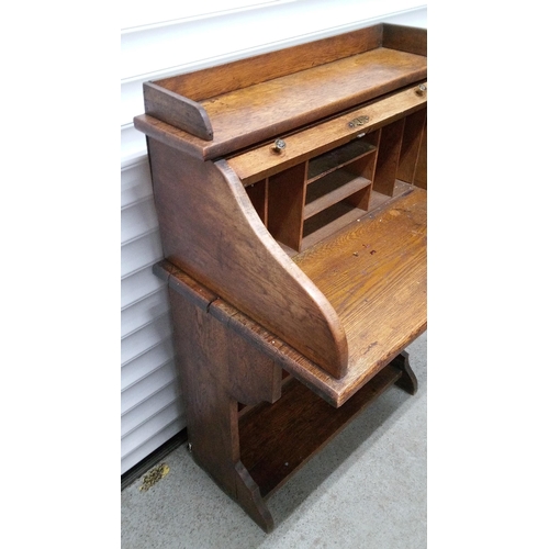 766 - An Antique Tambour Top Writing Desk with Lower Shelves. 104cm H x 75cm W x 50cm D.