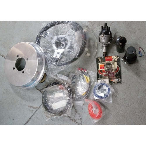 94 - A Box of Car Parts and Accessories. Steering Wheel, Polish, Halogen Lights etc.