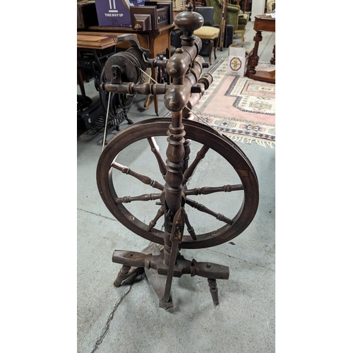 603 - An Antique Spinning Wheel.