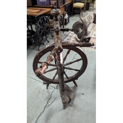 603 - An Antique Spinning Wheel.