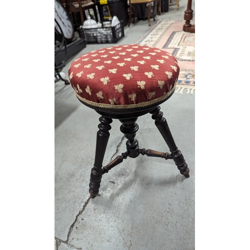 610 - An Antique Piano Stool.