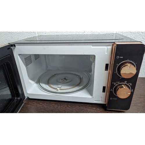 232B - A Tower 800 Watt Microwave in Black and Rose Gold. Seen Working.