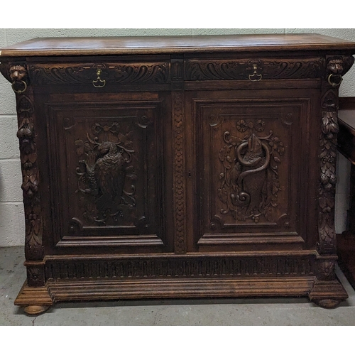 792B - An Oak Heavily Carved Buffet Sideboard with Fish and Foul Motifs.