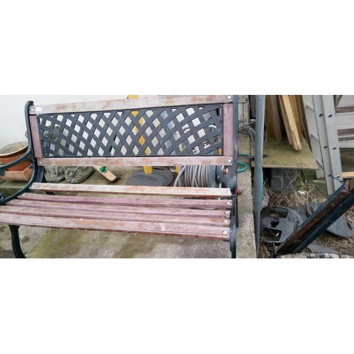 166 - A Garden Bench with Metal Ends and a Back Panel.