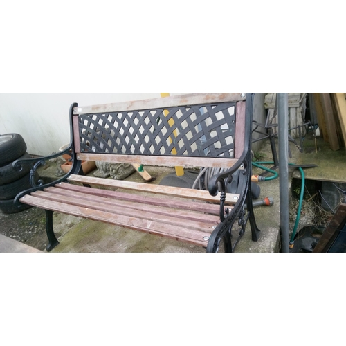 166 - A Garden Bench with Metal Ends and a Back Panel.