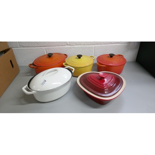 203 - 3 Le Creuset Casserole Dishes with 1 Yellow Round No.22,
1 Orange round No.22, 1 Oval Orange No.27, ... 