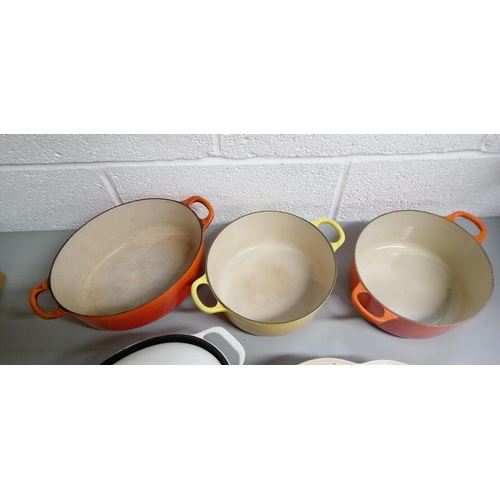 203 - 3 Le Creuset Casserole Dishes with 1 Yellow Round No.22,
1 Orange round No.22, 1 Oval Orange No.27, ... 