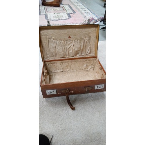 596 - A Well Travelled Brown Leather Suitcase.