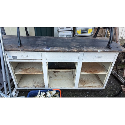 135 - A Large Workbench on Metal Cabinet Base.