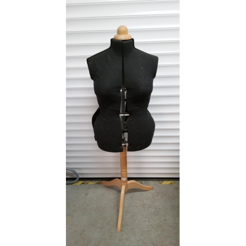 897 - An Adjustable Dress Makers Dummy on Wooden Stand.