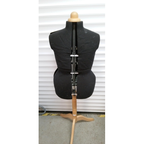 897 - An Adjustable Dress Makers Dummy on Wooden Stand.