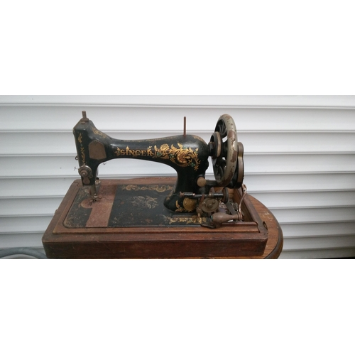 898 - A Singer Sewing Machine in Wooden Case.