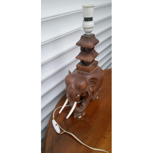 905 - A Carved Elelphant with Pagodo Lamp. 40cm x 30cm.