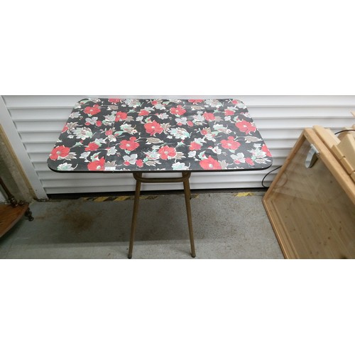 710 - A Metal Framed Drop Leaf Table Kitchen Table with Floral Pattern.