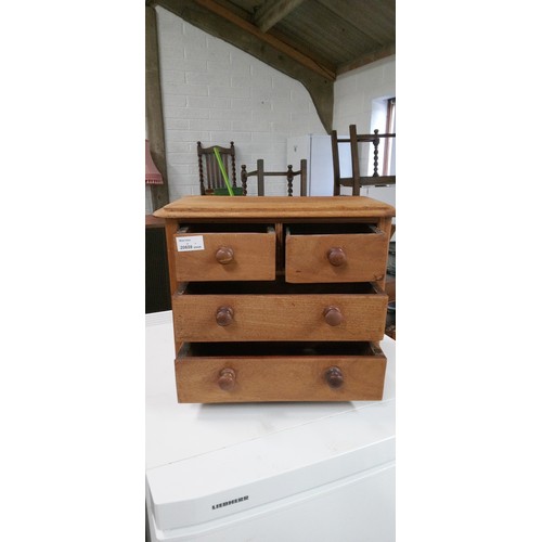 708 - A Miniature 4 Drawer Chest 32cm H x 40cm W x 30cm D.