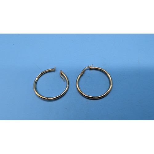 443B - A Pair of 9ct Hoop Gold Earrings.