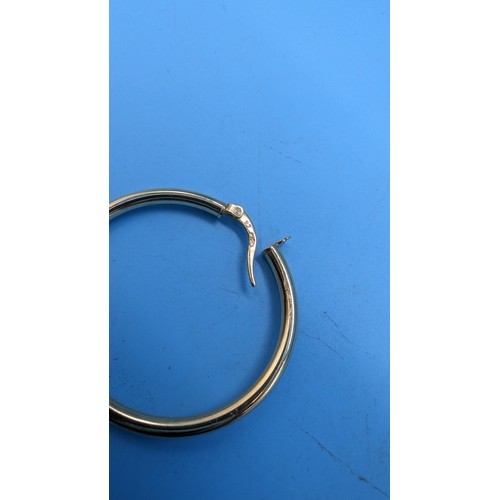 443B - A Pair of 9ct Hoop Gold Earrings.