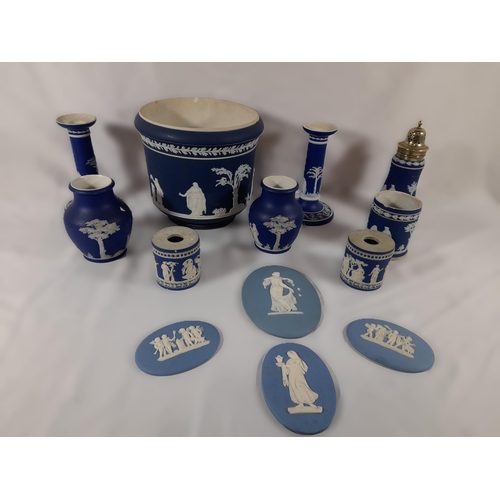 276 - A Collection of Wedgewood Jasperware including Candle Stick Holders, Vases and More.