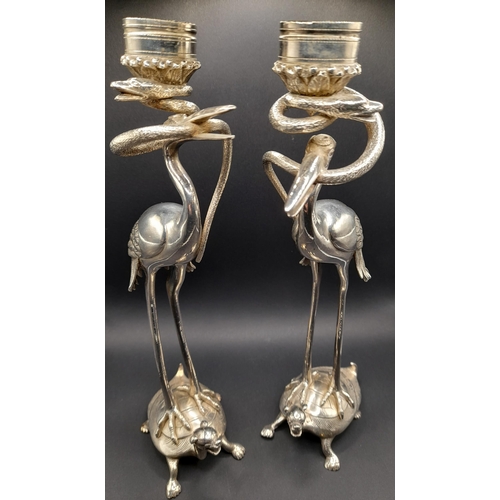 291 - A Pair of Stork and Snake Design Candlestick Holders, 27cm H,  and a Solid Brass Snake.