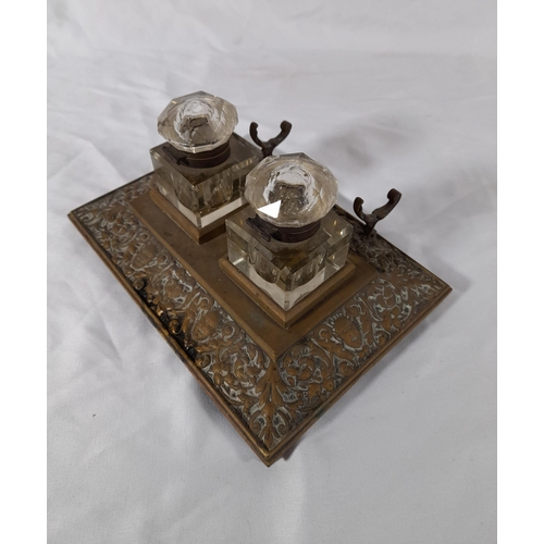 62 - An Antique Brass and Crystal Double Ink Well with Pen Rest. No Chips to Inkwells. 21.5cm L x 15cm D ... 