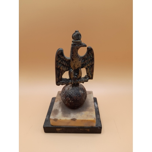 22 - A Brass Eagle Statuette, 13cm H x 8cm W, and a Brass Staff Head with the initials B S, 19cm H x 8cm ... 