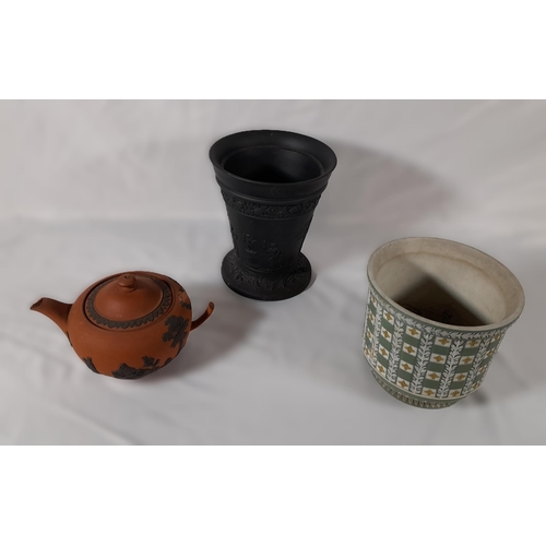 302 - 3 Pieces of vintage Wedgewood comprising of terracotta 
tea pot ( damaged handle as pictured) , blac... 