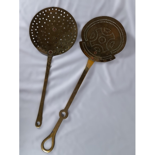 306 - A Pair Of Antique Brass Skimmers, 19 and 20cm diameter,
48 and 57cm in length