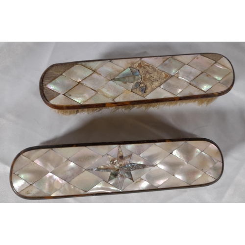 309 - Set Of 3 Antique Mother Of Pearl Clothes brushes with matching hand mirror