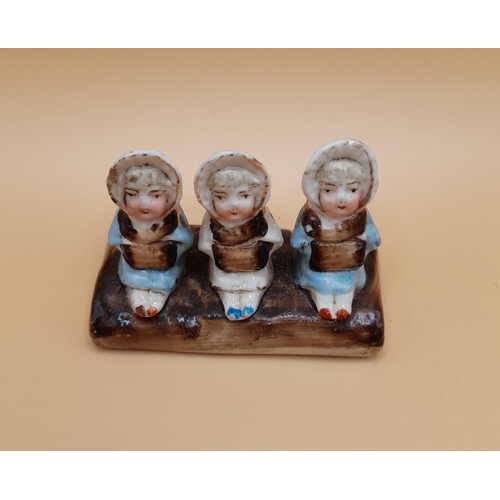 324 - Two Victorian Ornaments, one of a Baby In a Shoe and the other of Three Sitting Ladies. No Damage to... 