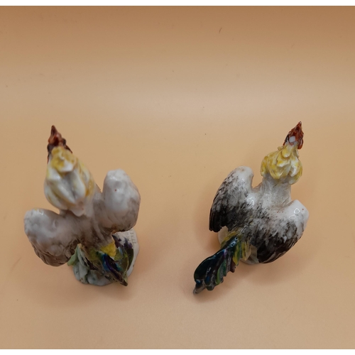 325 - A Pair of Base Signed Cock Fighting Ornaments, tallest approx. 6.5cm H.