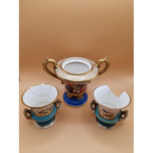 329 - 3 Small Urn Style Vases. The larger is 9.5cm H with Floral and Gilt Decoration and has 