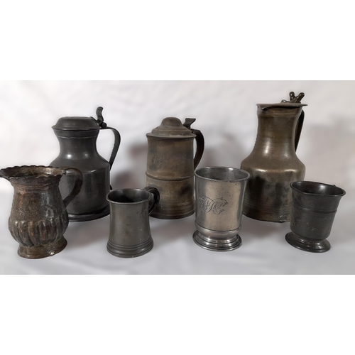 337 - A Collection of Pewter Items including 3 Lidded Tankards/Jugs and 4 Smaller Pewter Tankards. 

Large... 